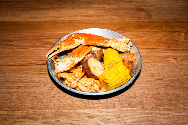 Snow Crab Combo — snow crab clusters and shrimp with corn, potatoes and sausage in Cajun garlic butter at Big Crab