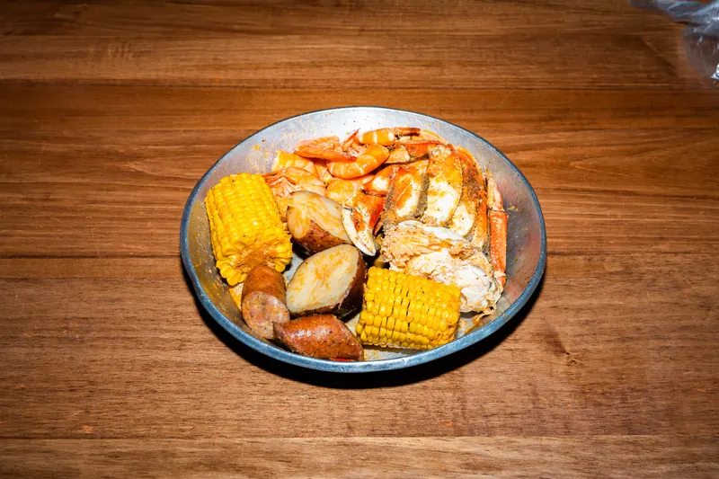 Dungeness Combo — Dungeness crab and shrimp with corn, potatoes and sausage in Cajun garlic butter at Big Crab