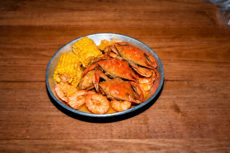 Blue Crab Combo — blue crabs and shrimp with corn, potatoes and sausage in Cajun garlic butter at Big Crab